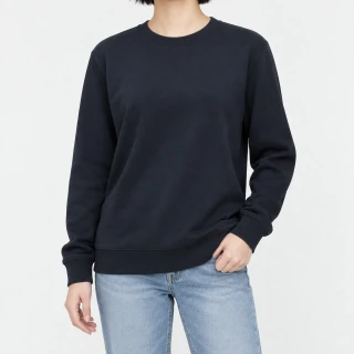 Front view of a model wearing a navy crewneck sweatshirt