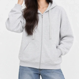 A model wearing a white melange light zip-up hoodie with a hand in the pocket