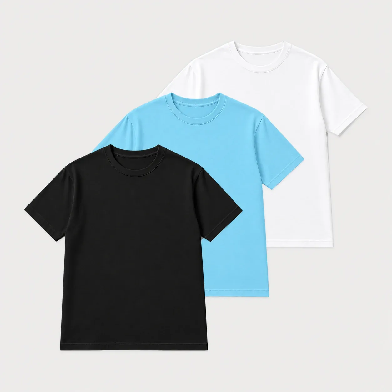 Black, sky blue and white short sleeve t-shirts layered together