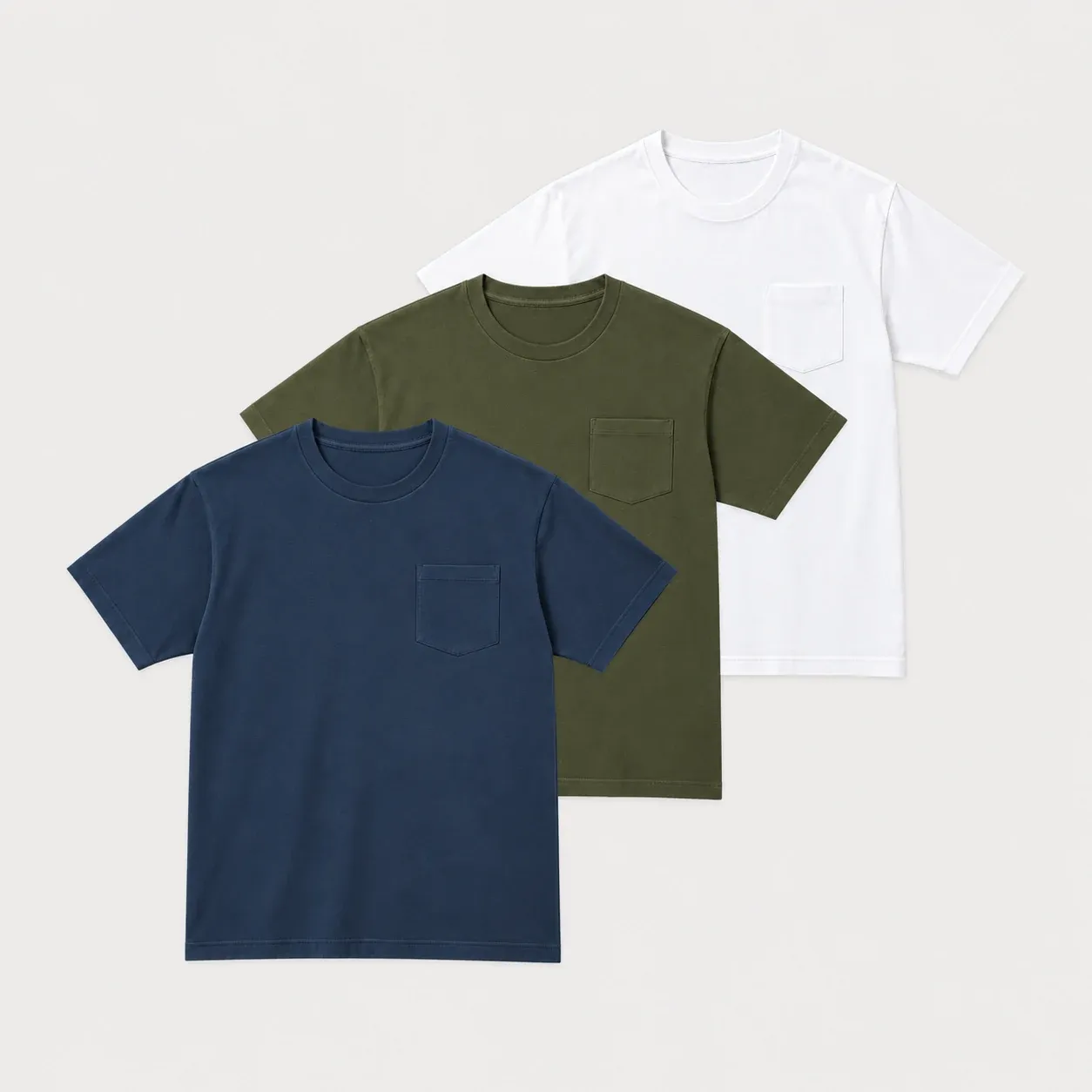 Navy, khaki and white pocket short sleeve t-shirts layered together