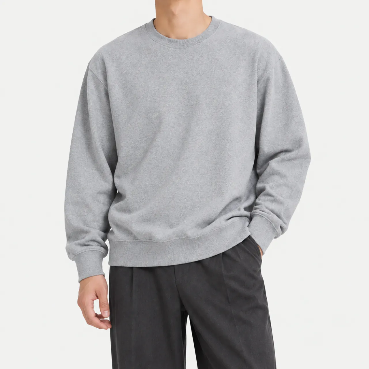Front view of a model wearing a gray oversized sweatshirt
