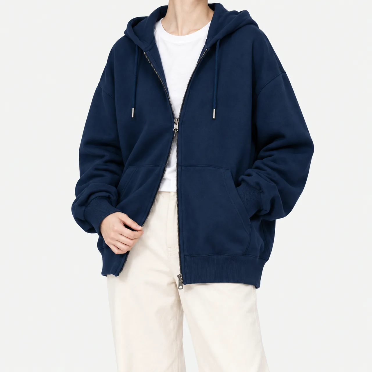 Front view of a model wearing a navy oversized French terry zip-up hoodie