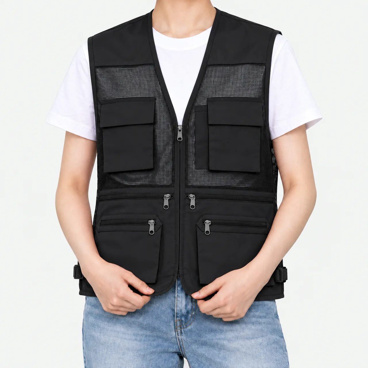 Front view of a model wearing a black pocket work vest