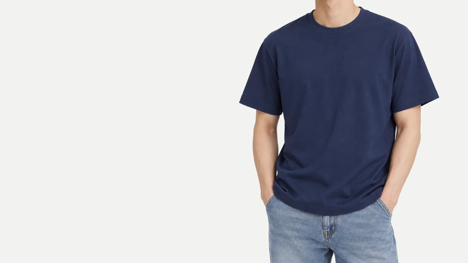 Model wearing a navy short-sleeve T-shirt